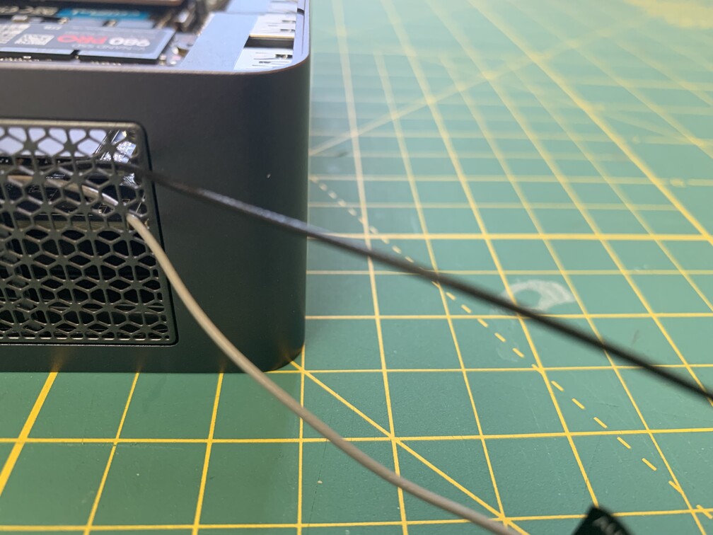 Close-up of antenna wires being pulled out of the case